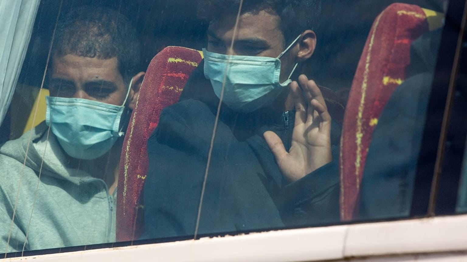 Migrants sit on a bus after being rescued in the Canary Island of Gran Canaria 