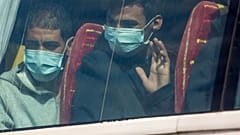 Migrants sit on a bus after being rescued in the Canary Island of Gran Canaria 