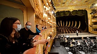 Spectators attend the performance of “Verdi e la Fenice” to mark the reopening of the Fenice Opera theatre in Venice.