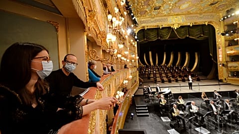 Spectators attend the performance of “Verdi e la Fenice” to mark the reopening of the Fenice Opera theatre in Venice.