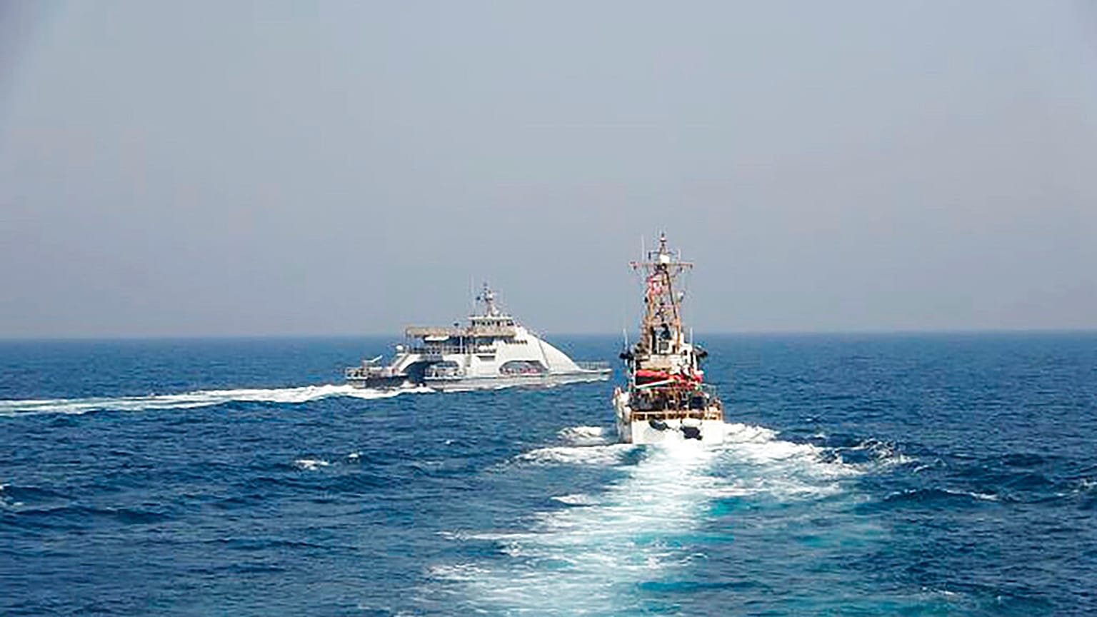 (April 2) Iranian vessel cuts across a US Navy ship as political tension in the Gulf increases