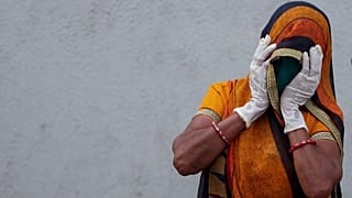 A relative of a patient who died of COVID, mourns outside a government hospital in Ahmedabad, India. April 27, 2021.