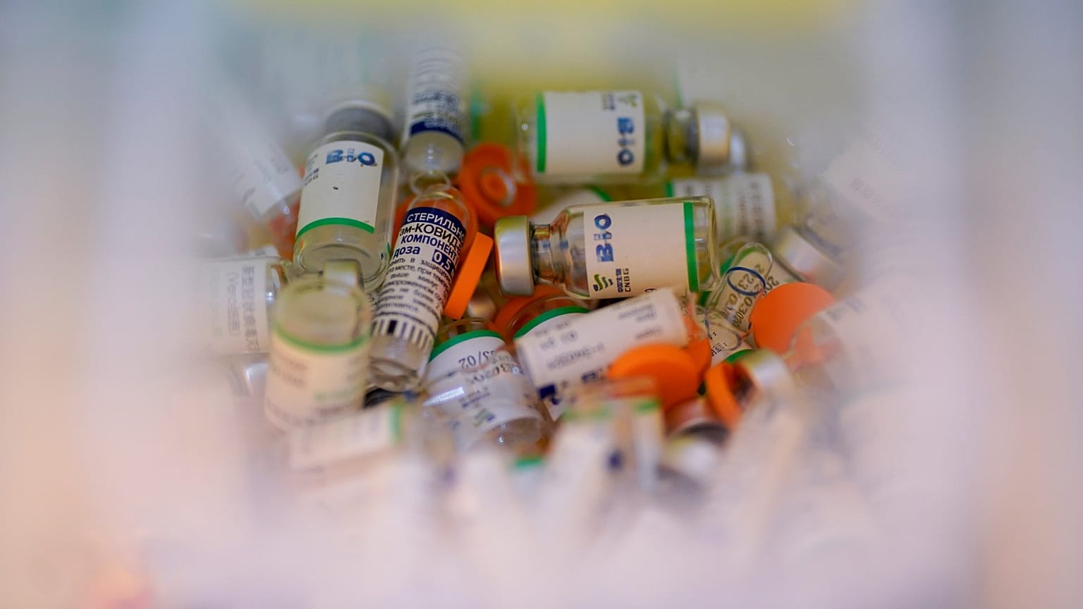 Empty vials of the Sputnik V COVID-19 vaccine and Sinopharm COVID-19 vaccine fill a container at Tecnopolis Park, in Buenos Aires, Argentina, April 15, 2021