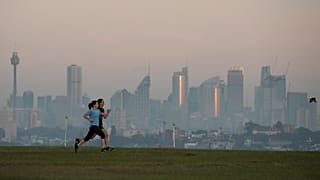 People exercise at a park as the sun rises in Sydney, Australia, Wednesday, April 28, 2021.