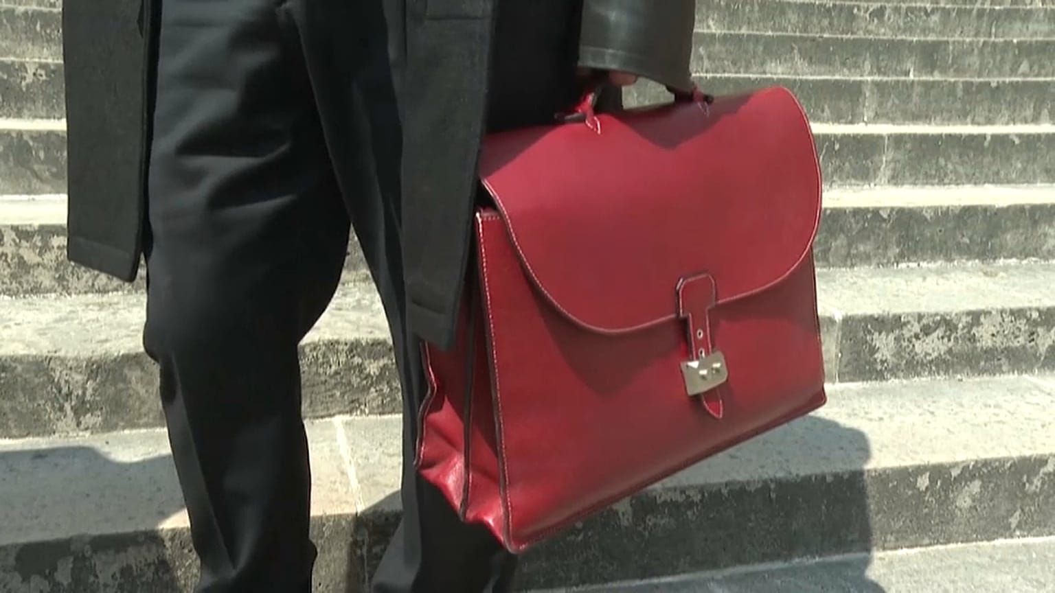 A lawyer for a former member of the Red Brigades leaves court in Paris on Thursday.
