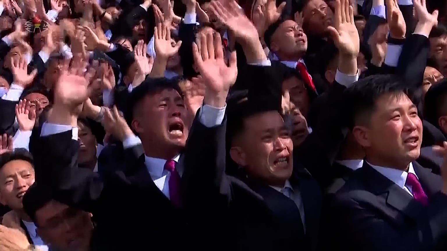 People clapping and cheering at the "Socialist Patriotic Youth League"