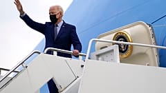 President Joe Biden waves at Dobbins Air Reserve Base, Ga., as he boards Air Force One to return to Washington, Thursday, April 29, 2021.