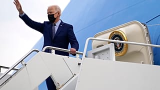 President Joe Biden waves at Dobbins Air Reserve Base, Ga., as he boards Air Force One to return to Washington, Thursday, April 29, 2021.