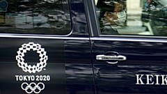 A taxi with the Tokyo 2020 Olympics logo on the door in Tokyo