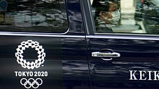 A taxi with the Tokyo 2020 Olympics logo on the door in Tokyo