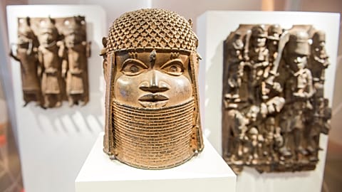 Three pieces of Benin Bronzes are displayed at Museum for Art and Crafts in Hamburg, Germany, Wednesday, Feb. 14, 2018