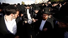 Mourners carry the body of Yhuda Libe Rubin, who died during Lag BaOmer celebrations