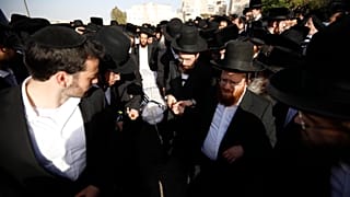 Mourners carry the body of Yhuda Libe Rubin, who died during Lag BaOmer celebrations