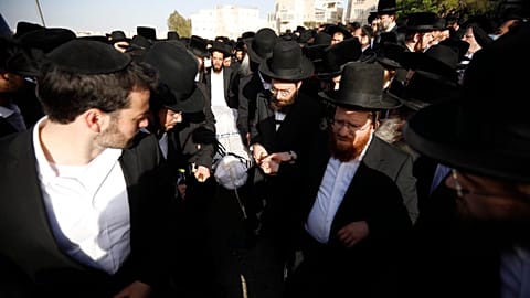Mourners carry the body of Yhuda Libe Rubin, who died during Lag BaOmer celebrations