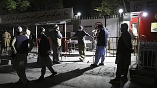 Afghans wait outside the hospital to see their relatives in Kabul, Afghanistan, Friday, April 30, 2021.