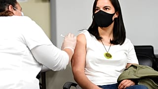 Madeline Gent from Aspinwall gets her second dose of the Moderna vaccine from Cristina McCarthy, a student nurse from Carlow University