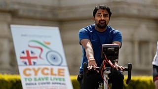 A man takes part in "Cycle to Save Lives" a 48 hour, non-stop static relay cycle challenge at the Neasden Temple in north London to raise money for relief efforts in India.fo