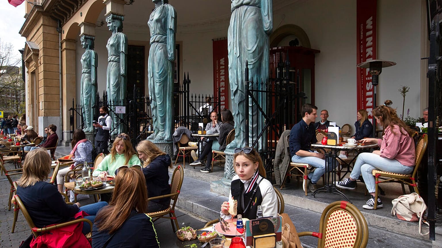 People toast as terraces reopened at midday in Utrecht, Netherlands, Wednesday, April 28, 2021.