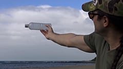 Jean Scuderi collecting plastic waste from a beach in northern Taiwan