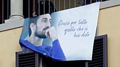 Supporters display a poster during the funeral ceremony of Davide Astori in Florence in March 2018.