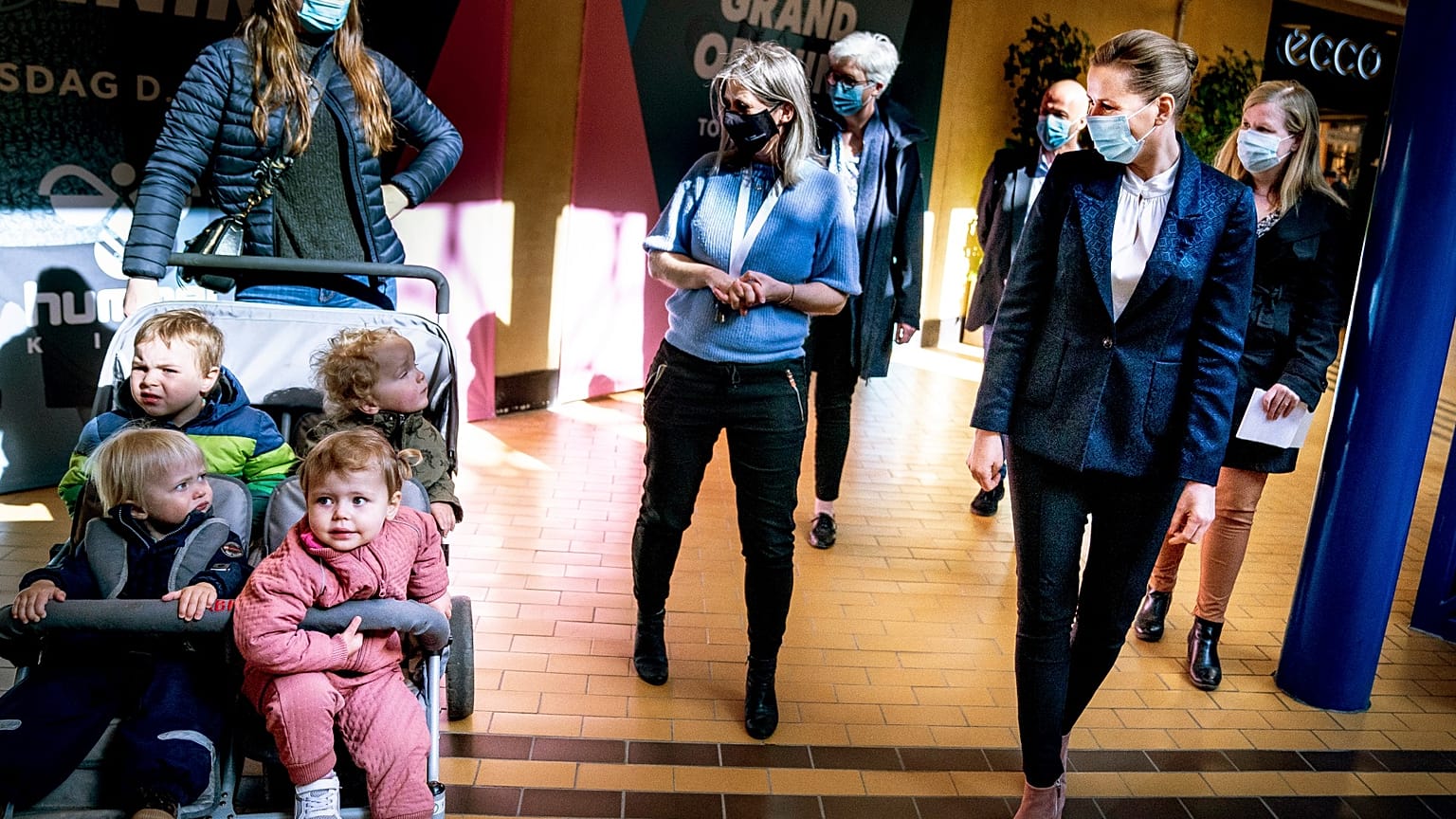 Denmark's Prime Minister Mette Frederiksen, right, meets people, during her visit to the shopping center SlotsArkaderne in Hilleroed, Denmark, Thursday 22 April 2021, 
