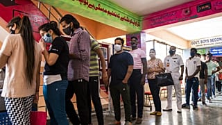 People line up to get the Covid-19 coronavirus vaccine in a school-turned-vaccination centre in New Delhi on May 3, 2021.