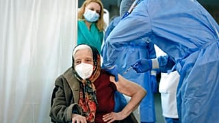 Zoea Baltag receives her second dose of the Pfizer COVID-19 vaccine in Bucharest,