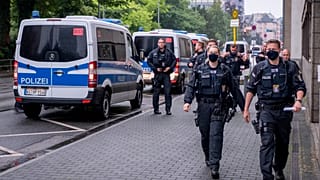 Police say the suspect had previously been convicted of crimes motivated by right-wing ideology.