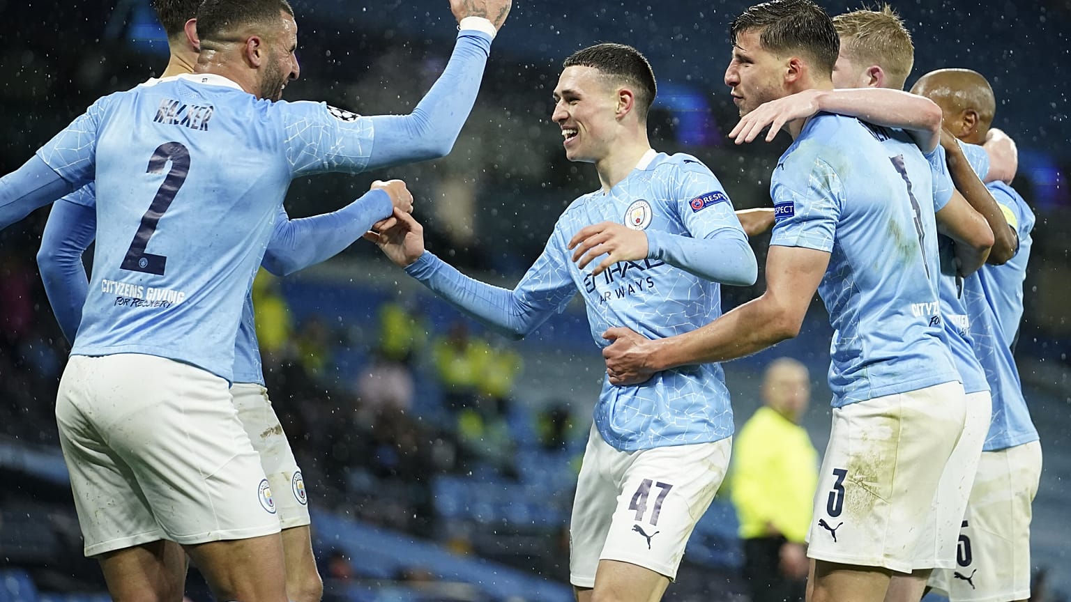 Manchester City's Riyad Mahrez celebrates with teammates after scoring his second goal in the Champions League semifinal match against PSG.