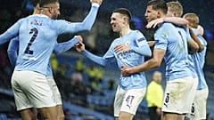 Manchester City's Riyad Mahrez celebrates with teammates after scoring his second goal in the Champions League semifinal match against PSG.