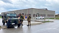 Financial police stand guart outside a modified courthouse in Calabria, Italy at the opening of a 'maxi-trial' of more than 350 alleged 'ndrangheta members in January