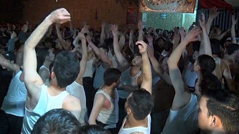 Shiite muslims beating their chests during a religious procession in Quetta