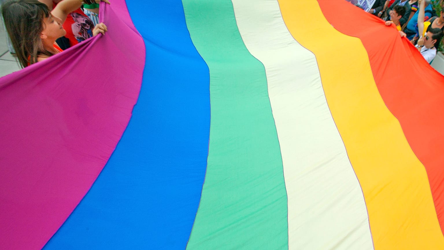 Gay rights activists carry the rainbow flag during a 2012 Pride march in Split, Croatia.