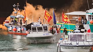 Fishing vessels at sea off the coast of Jersey, Thursday, May 6, 2021. French fishermen angry over loss of access to waters off their coast have gathered their boats.