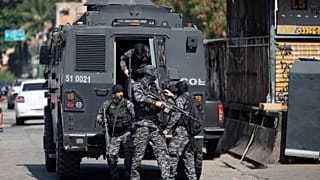 Police get out of an armored vehicle during an operation against alleged drug traffickers in the Jacarezinho favela of Rio de Janeiro, Brazil, Thursday, May 6, 2021.