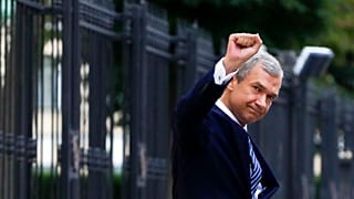 In this Aug. 25, 2020, file photo, oppositon leader Pavel Latushko, greets his supporters and journalists in Minsk.