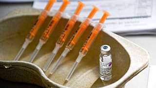 In this Sunday, March 21, 2021 file photo a vial and syringes of the AstraZeneca COVID-19 vaccine, at the Guru Nanak Gurdwara Sikh temple, in Luton, England.