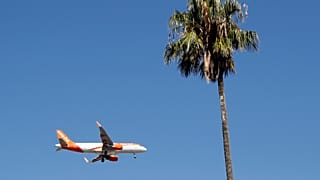 FILE - In this Aug. 21, 2019 file photo, an easyJet airplane approaches Lisbon airport for landing. 