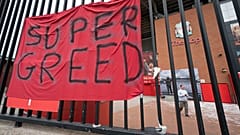 In this file photo dated Wednesday, April 21, 2021, a protest banner against the proposed Super League is seen outside Liverpool's Anfield Stadium