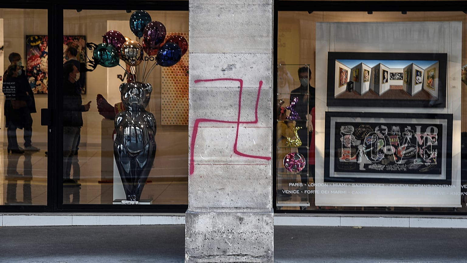 FILE: A picture shows a swastika spray painted on a column of the Rivoli street in central Paris on October 11, 2020. 