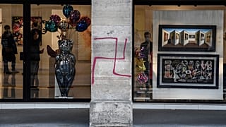 FILE: A picture shows a swastika spray painted on a column of the Rivoli street in central Paris on October 11, 2020. 
