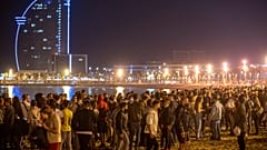 People crowded on the beach in Barcelona, Spain, Sunday, May 9, 2021.