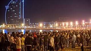 People crowded on the beach in Barcelona, Spain, Sunday, May 9, 2021.