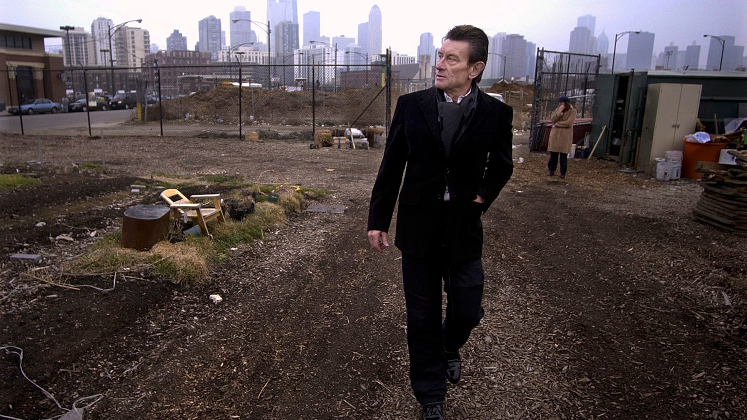 architect Helmut Jahn walks through a vacant lot on Chicago's near north side. 