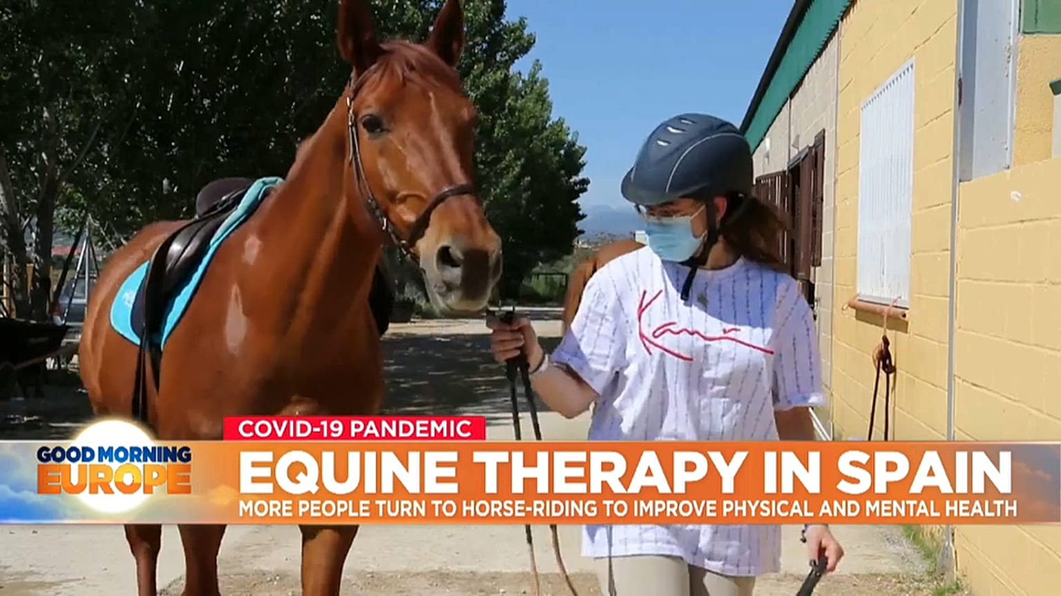 Horse and rider in equine therapy session in Spain.