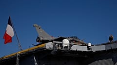 Nuclear-powered aircraft carrier Charles de Gaulle with with a French flag at Limassol port, Cyprus