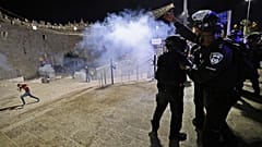Israeli security forces disperse people from Jerusalem's Damascus Gate.