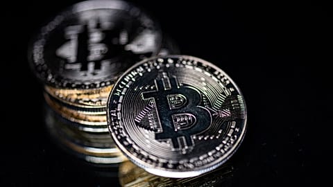 A physical imitation of the Bitcoin cryptocurrency is seen as Hungary moves to halve tax on crypto earnings.