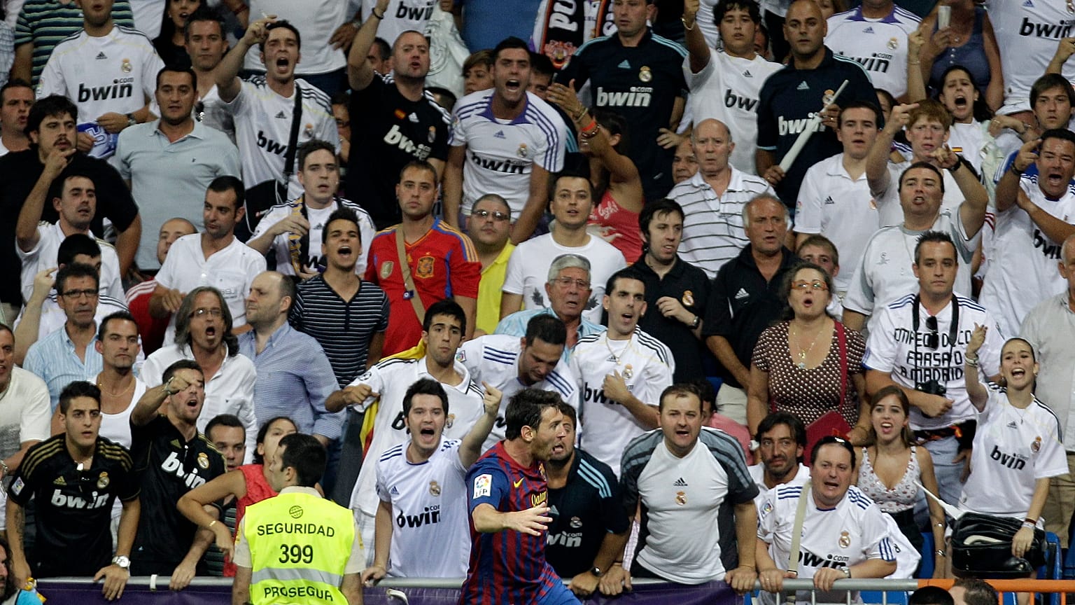 FILE:  Real Madrid fans follow the first leg of the Spanish Supercup soccer match at the Santiago Bernabeu stadium in Madrid Sunday Aug. 14, 2011. 