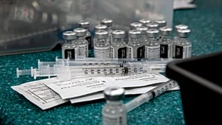 Doses of the Pfizer coronavirus vaccine are seen being prepared on May 12, 2021, in Decatur, US.